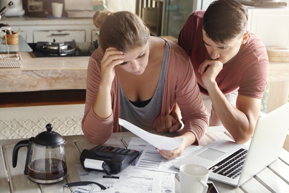 couple looking at bills